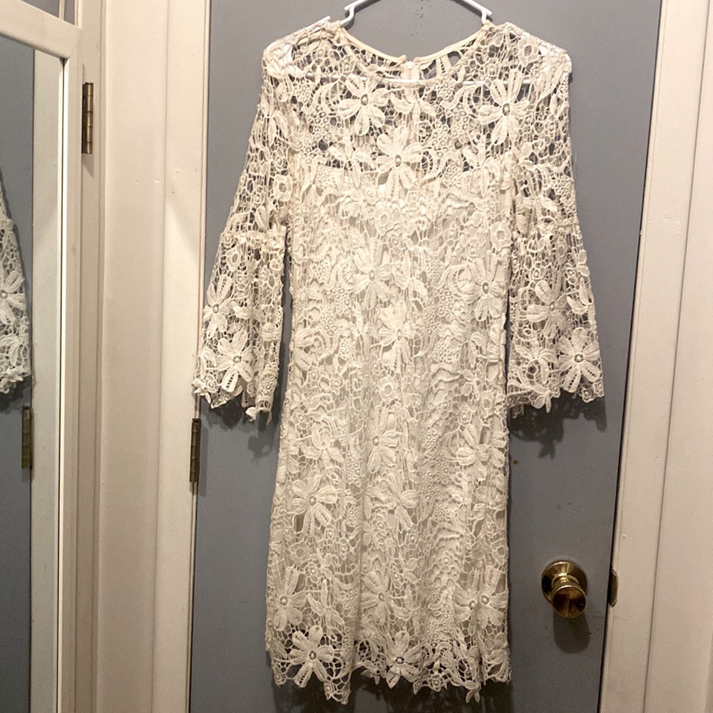 Two beautiful ladies dresses that are lines from head to toe. A must have